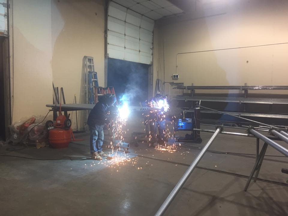 Welding steel gate frames in the workshop — photograph supplied by LS Fencing & Metal Work