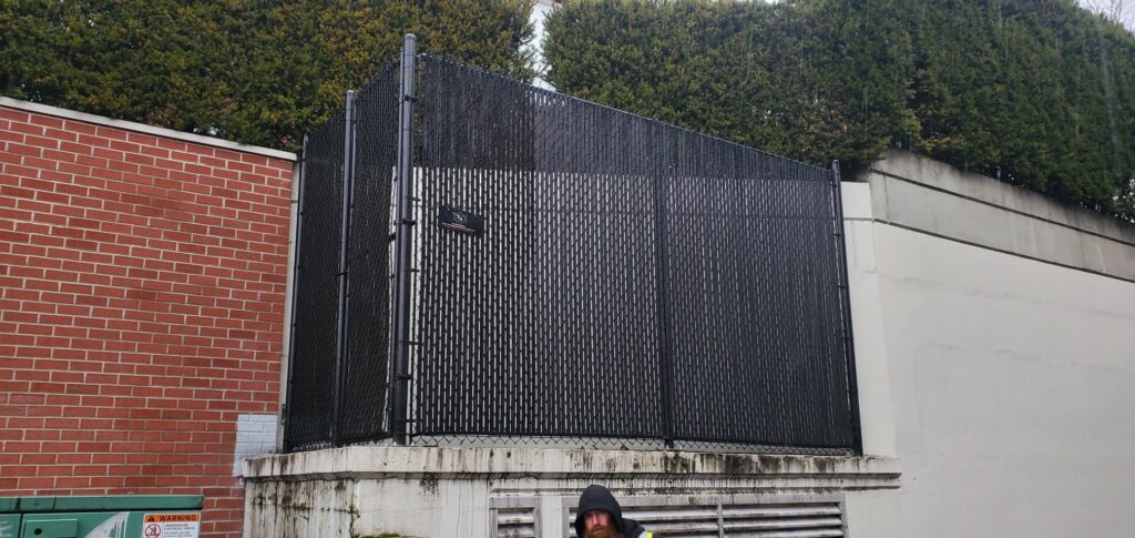 Commercial perimeter fence with chain link panels