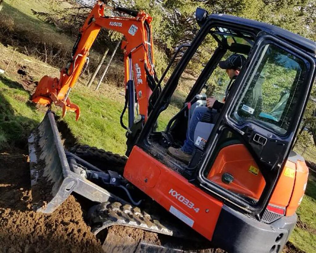 Bobcat excavation services clearing property in Abbotsford